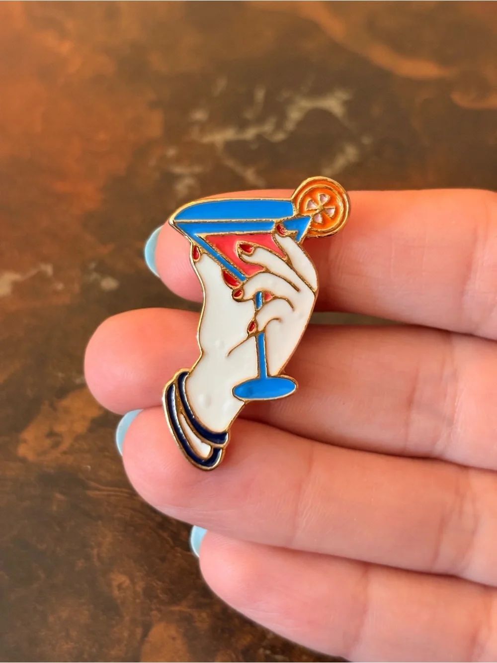 Hand Holding Martini Cocktail Enamel Pin - Blue & White Pin